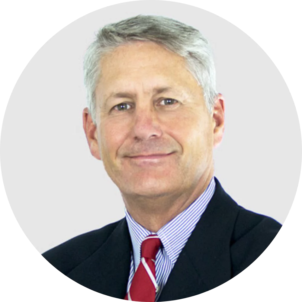 Smiling man in suit and red tie
